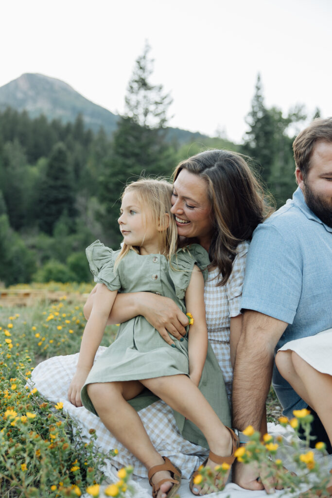 Mother and daughter playing in the mountains in a candid family photo