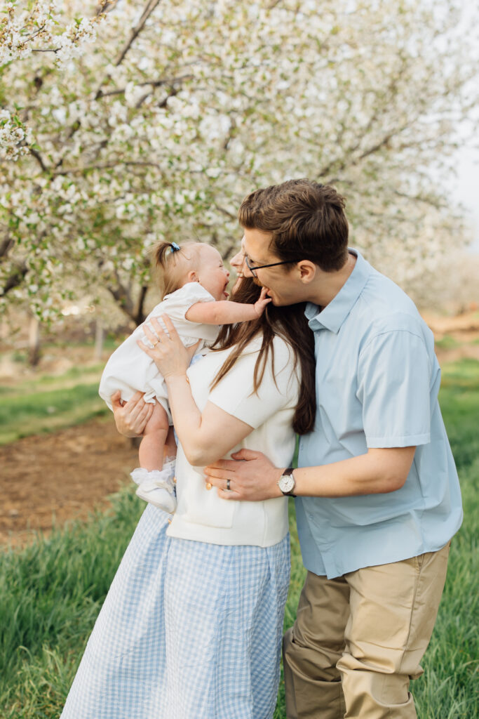 young family smiles at spring family photoshoot