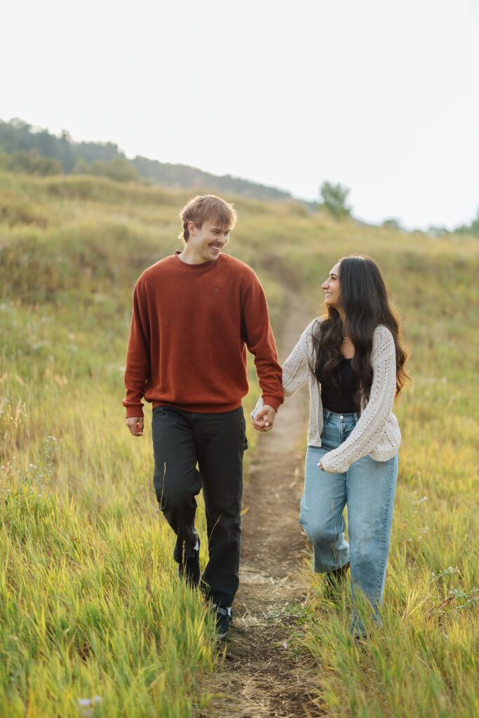 Couple smiles at each other at Buffalo Peak in this Provo Engagement Session